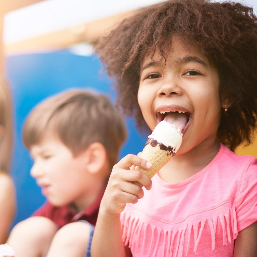 young child eating ice cream