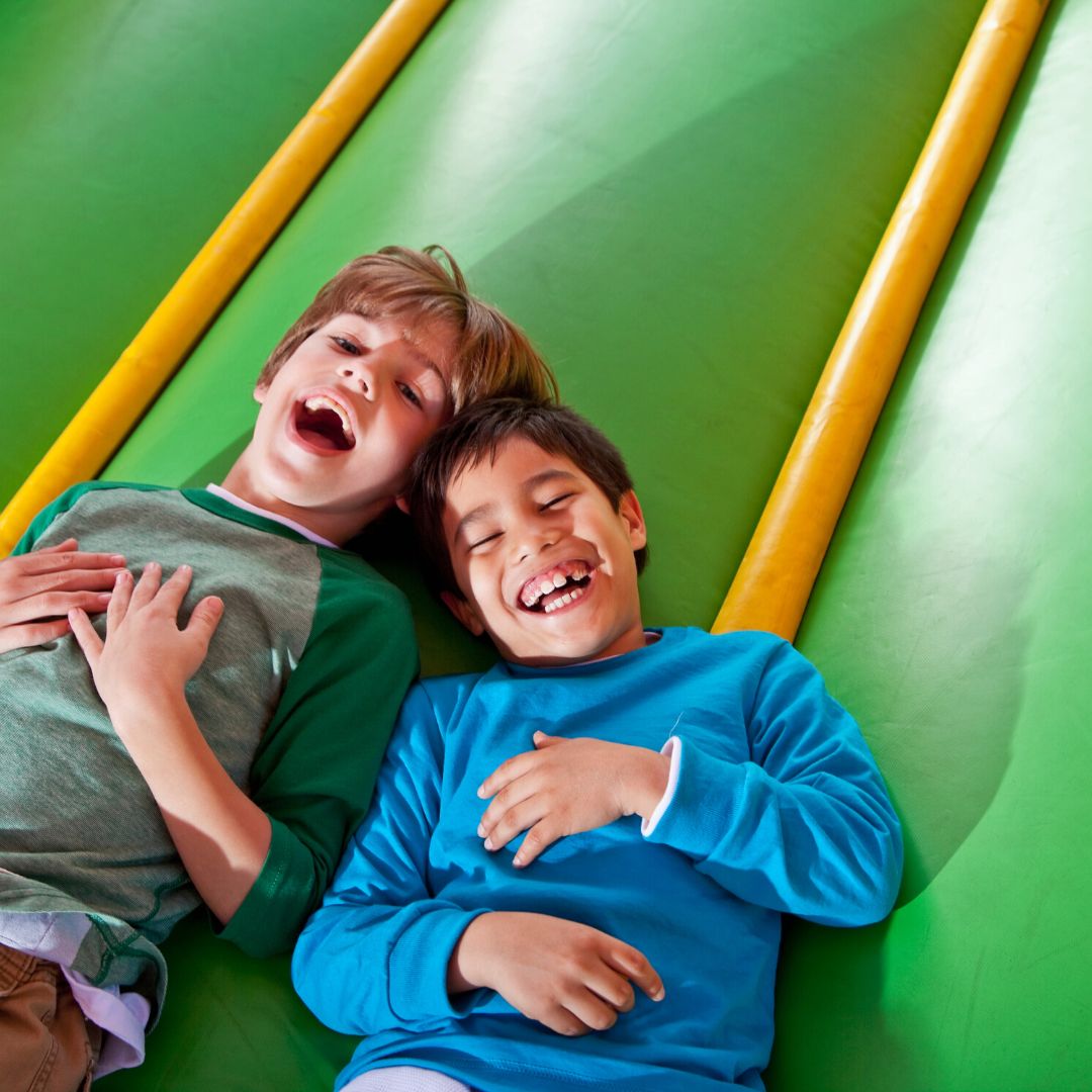 kids laughing on slide