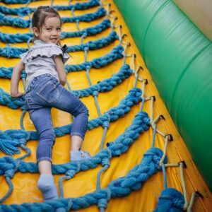 img of a child on a bouncy slide