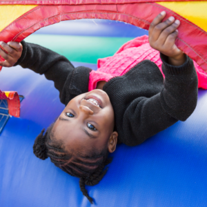 girl laying down in bounce house