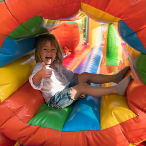 little girl in bounce house