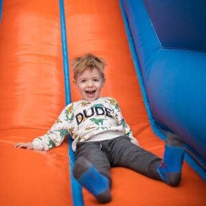 img of a child on a bouncy slide