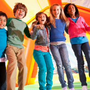 kids jumping in bounce house