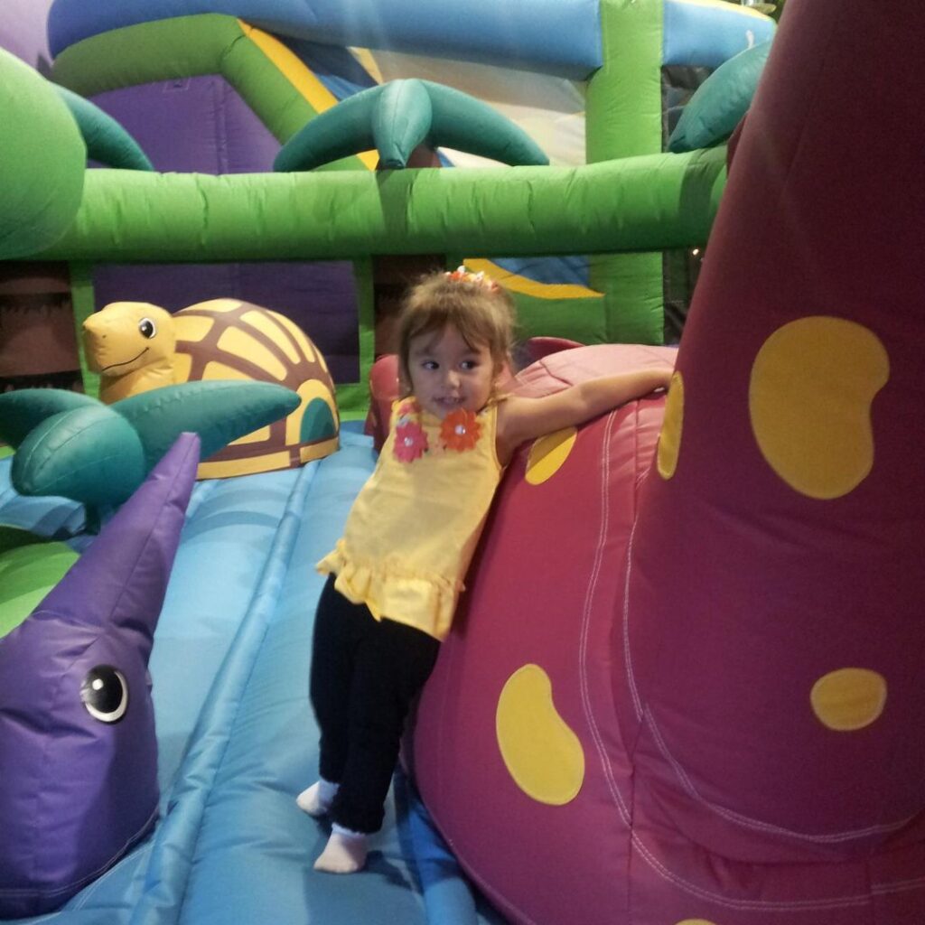 child at jumpin jamboree's indoor bounce house