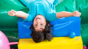 happy kid on bouncy castle