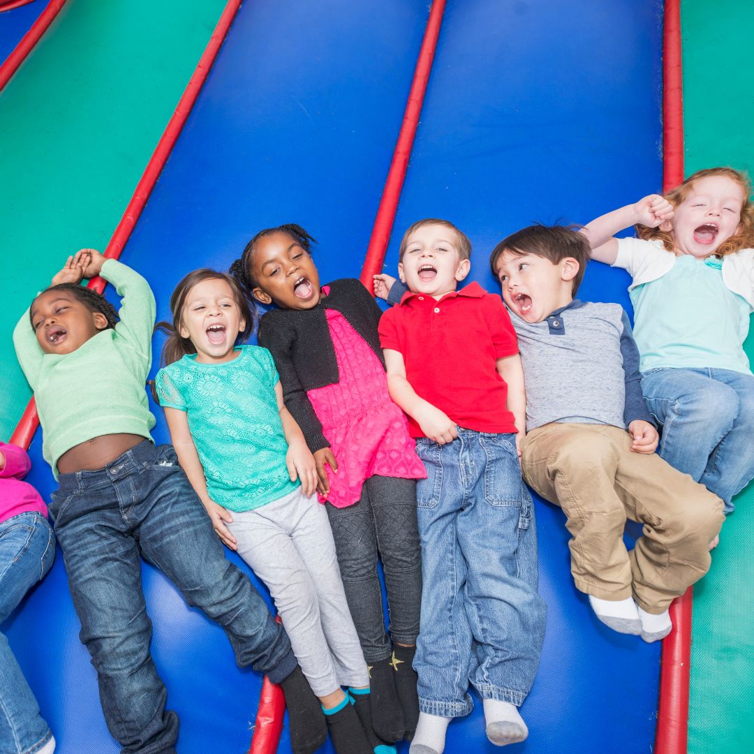 kids lying down in bounce house