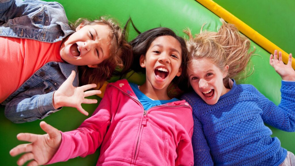 smiling children in bounce house