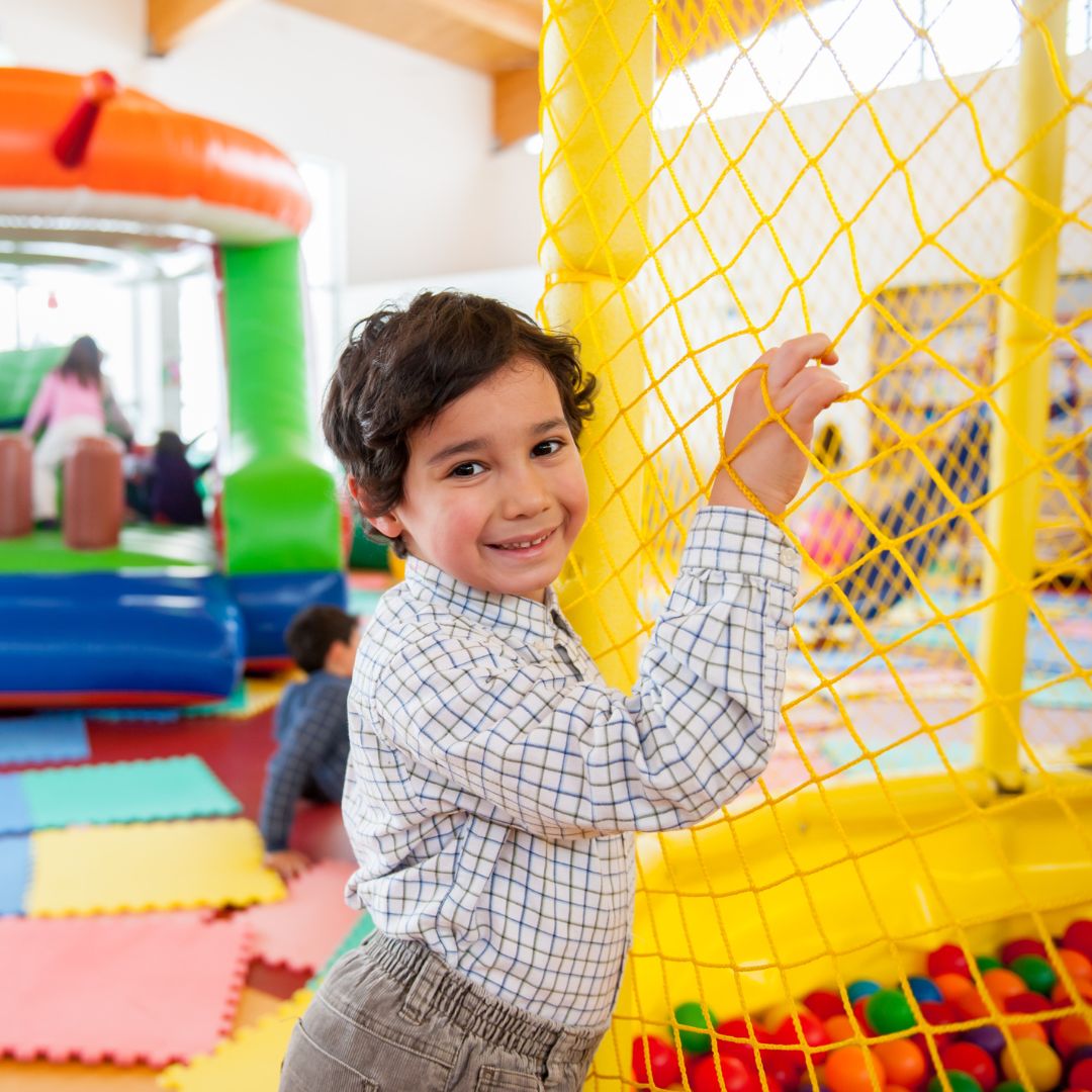 a happy child at an indoor play place