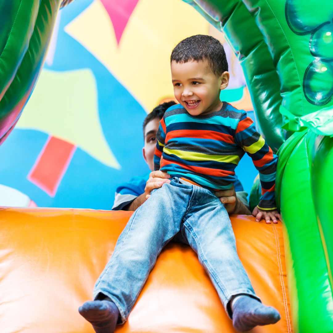 Happy child at indoor bounce playplace