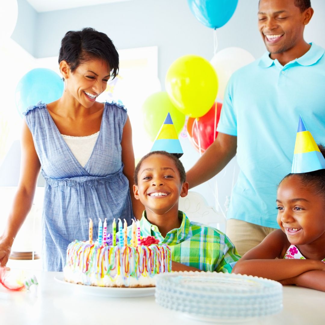 A child smiling at his birthday party