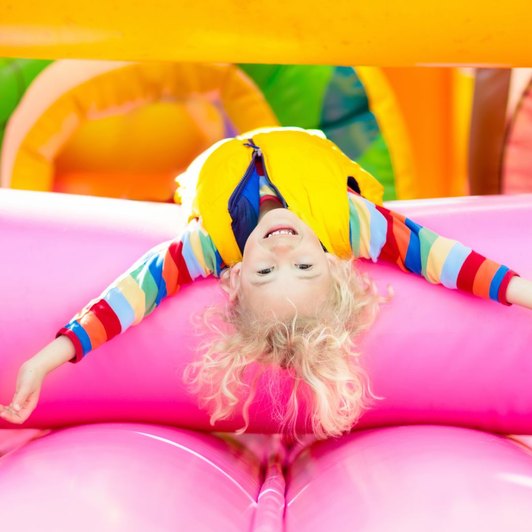 img of a child on an inflatable castle