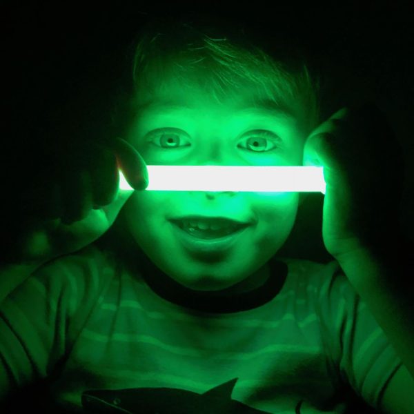 kid with a glow stick