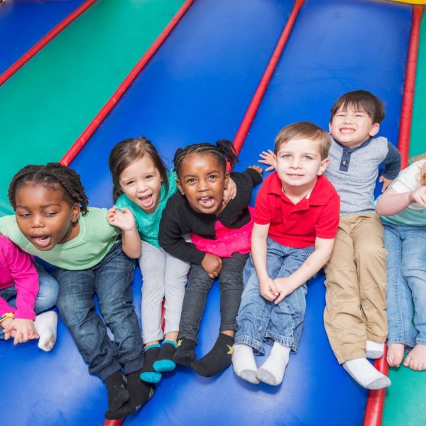 kids smiling on bounce house