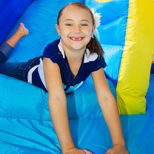 girl on slide of bounce house