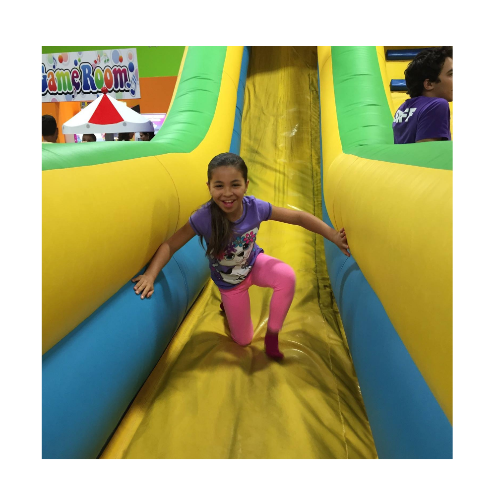 kid playing on inflatable playground